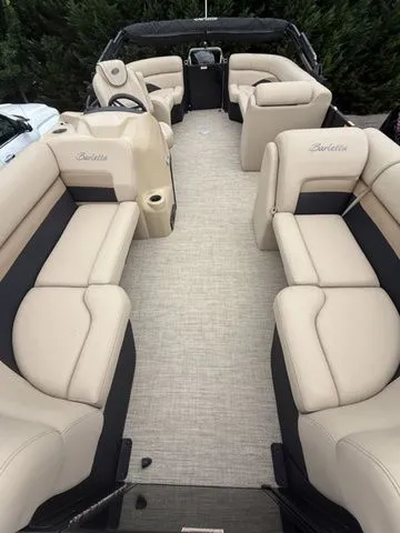 Slide: The Image of 2020 Barletta C20Q boat interior with beige seating and spacious layout. - 3