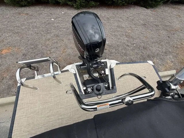 Slide: The Image of Barletta Boats C20Q 2020 model with outboard motor and stainless steel railings. - 7