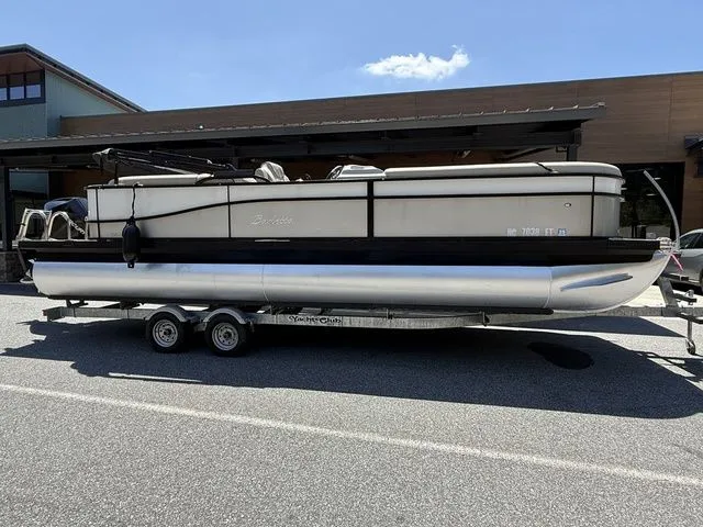 The Image of 2021 Barletta Boats C24Q pontoon on trailer, parked outdoors. - 1