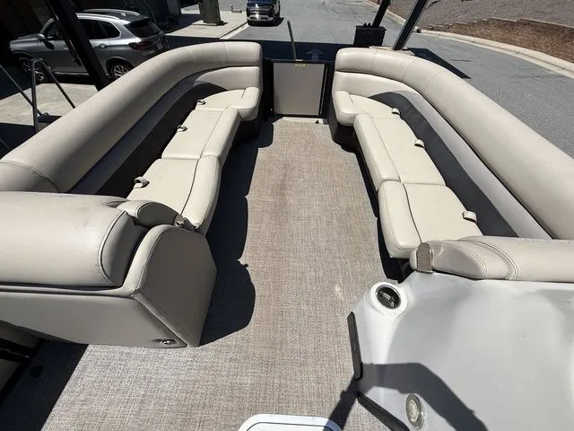 Slide: The Image of 2021 Barletta Boats C24Q interior with spacious seating and modern design. - 13