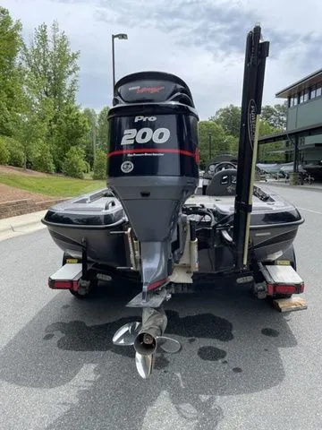 Slide: The Image of 2008 Bee Line Super Vee boat with Pro 200 outboard motor, parked outdoors. - 3