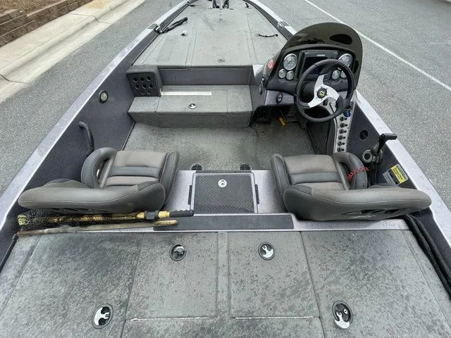 Slide: The Image of 2008 Bee Line Super Vee boat interior with dual seats and steering console. - 6
