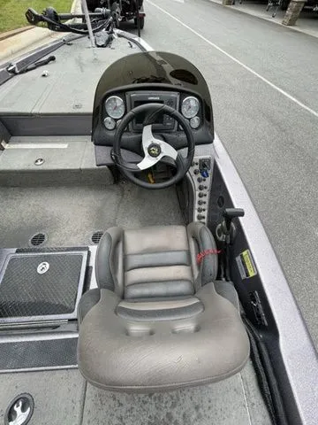 Slide: The Image of 2008 Bee Line Super Vee boat cockpit with steering wheel and dashboard controls. - 7