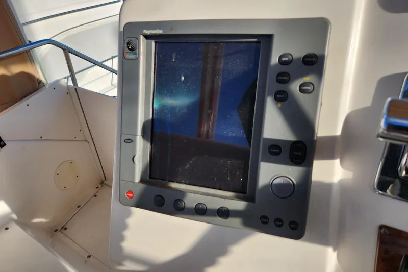 Slide: The Image of Control panel of a 2001 Silverton 392 Motor Yacht with navigation display. - 10