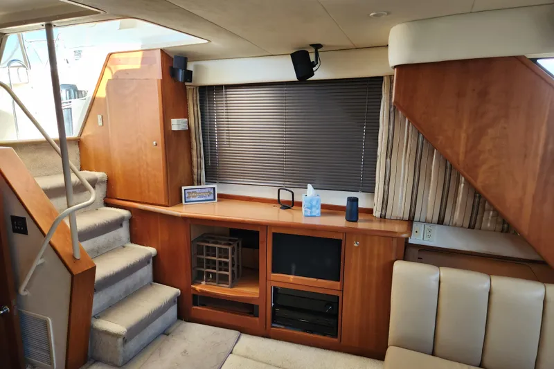 Slide: The Image of Interior of 2001 Silverton 392 Motor Yacht with wooden cabinetry and carpeted stairs. - 20