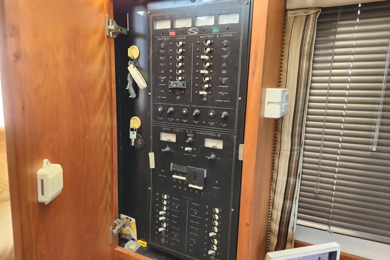 Slide: The Image of Electrical control panel inside a 2001 Silverton 392 Motor Yacht cabin. - 32