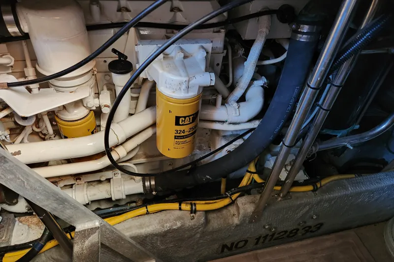 Slide: The Image of Engine compartment of a 2001 Silverton 392 Motor Yacht with CAT oil filter. - 34