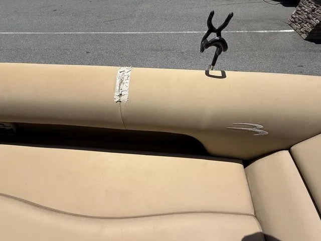 Slide: The Image of Torn beige upholstery on a 2016 Bennington 22 SSX boat seat. - 13