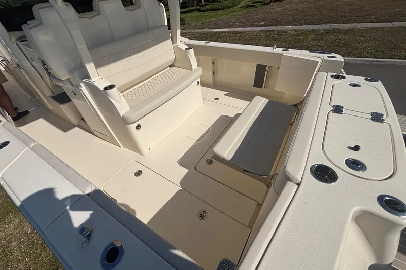 Slide: The Image of 2026 Scout 357 LXF boat interior with seating and storage compartments. - 13