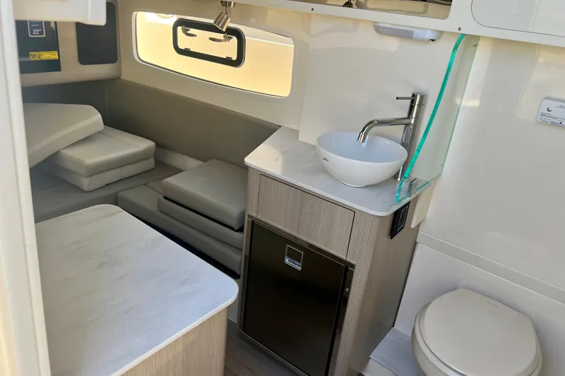 Slide: The Image of Interior of 2026 Scout 357 LXF boat with modern amenities and compact design. - 26