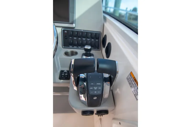 Slide: The Image of Control panel of a 2014 Boston Whaler 315 Conquest boat cockpit. - 28