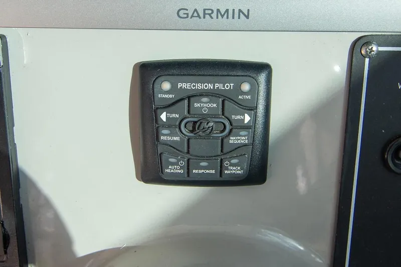 Slide: The Image of Control panel of a 2014 Boston Whaler 315 Conquest with Garmin Precision Pilot system. - 29