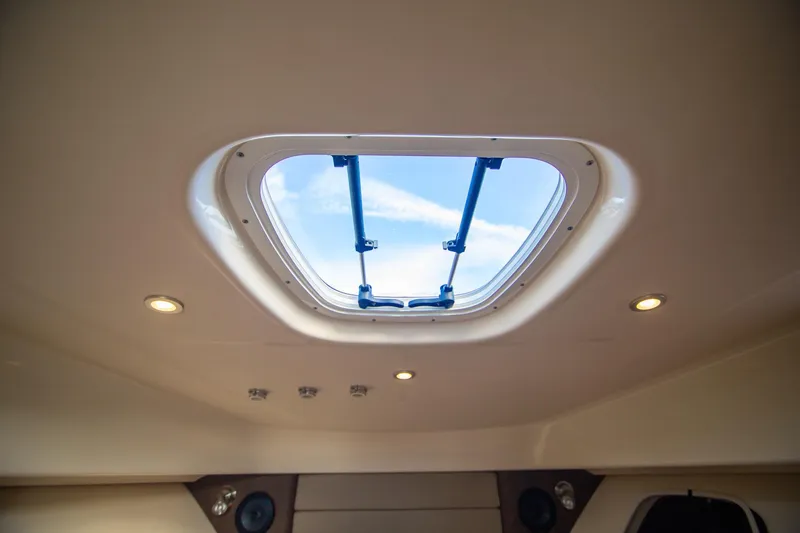 Slide: The Image of Cabin skylight view inside 2014 Boston Whaler 315 Conquest boat. - 31