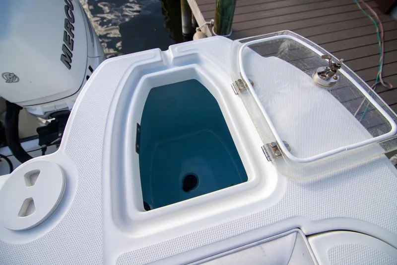 Slide: The Image of Open storage compartment on a 2014 Boston Whaler 315 Conquest boat deck. - 39