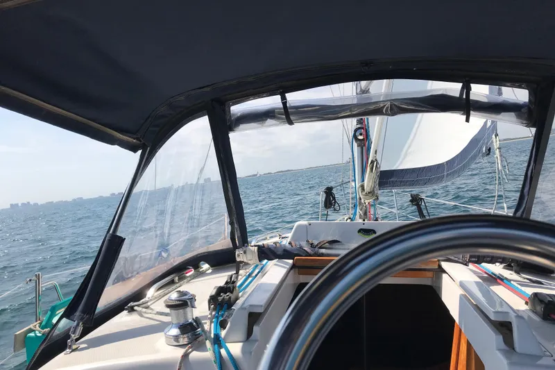 Slide: The Image of Sailing on a 2003 Hunter 306 yacht, view from the cockpit over the ocean. - 3