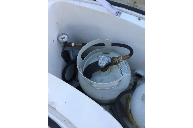 Slide: The Image of Propane tank setup in a 2003 Hunter 306 boat compartment. - 9