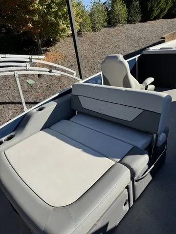Slide: The Image of 2022 Godfrey Pontoons Monaco 235 interior with comfortable seating and sleek design. - 6