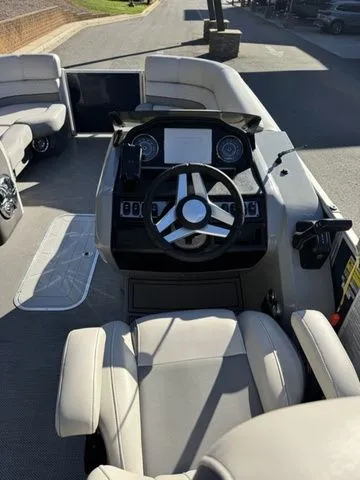 Slide: The Image of 2022 Godfrey Pontoons Monaco 235 interior with steering wheel and seating. - 7
