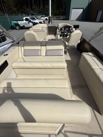 Slide: The Image of 2017 Sylvan 8524 DLZ LE pontoon boat with beige seating and steering console. - 4