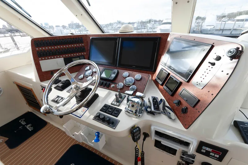 Slide: The Image of Helm of 2007 Novatec 55 Islander CPMY with advanced navigation controls and displays. - 11