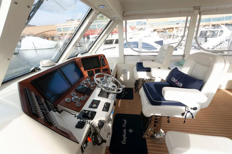 Slide: The Image of Luxurious helm of 2007 Novatec 55 Islander CPMY yacht with modern controls and captain's chairs. - 13