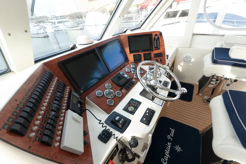 Slide: The Image of Cockpit of 2007 Novatec 55 Islander CPMY with modern navigation equipment and steering wheel. - 14