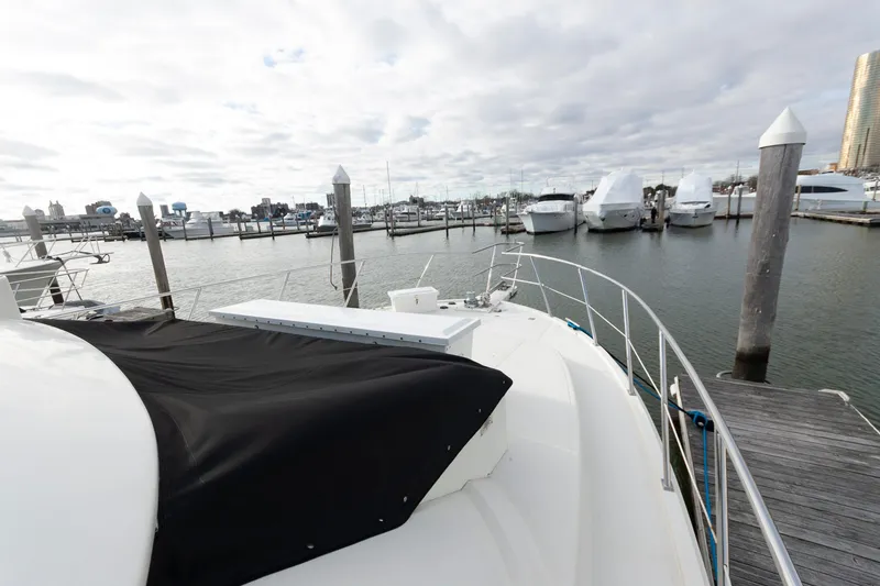 Slide: The Image of 2007 Novatec 55 Islander CPMY yacht docked at a marina with cloudy skies. - 21