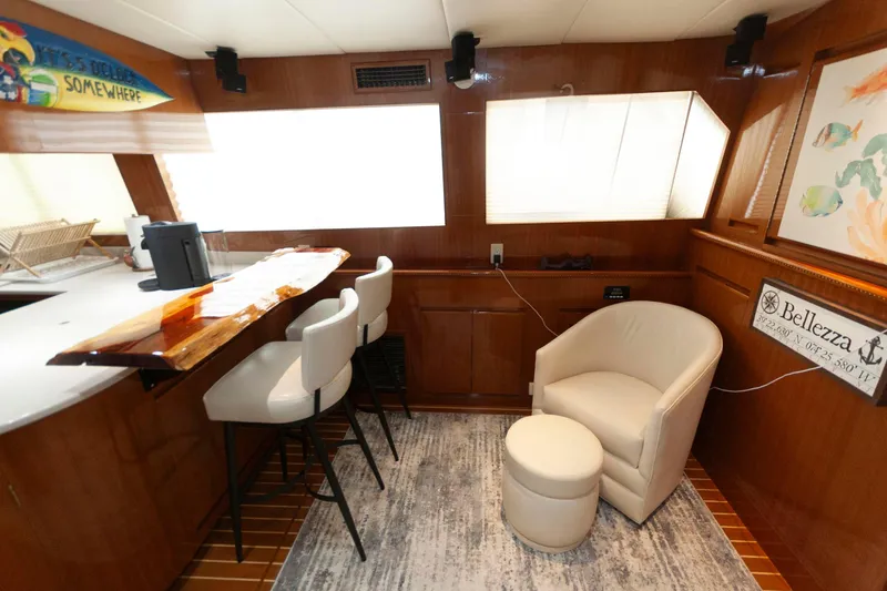 Slide: The Image of Luxurious interior of 2007 Novatec 55 Islander CPMY yacht with bar and seating area. - 31