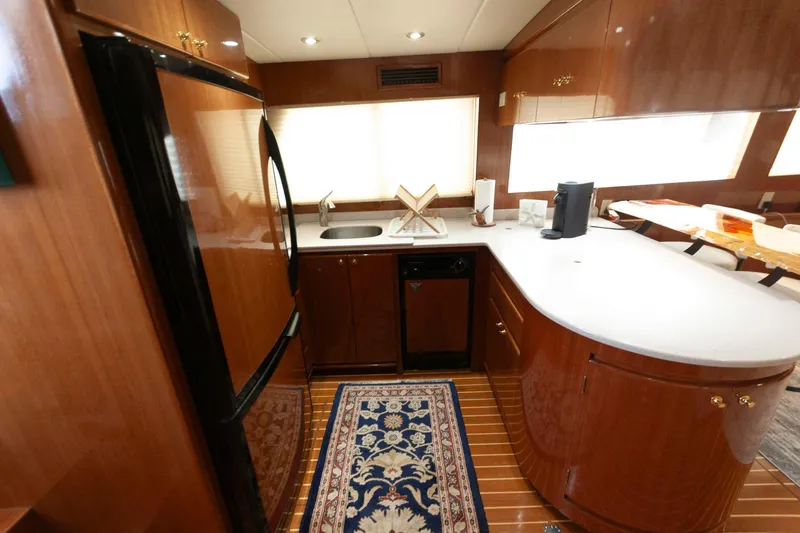 Slide: The Image of Luxurious kitchen interior of 2007 Novatec 55 Islander CPMY yacht with wood cabinetry. - 33