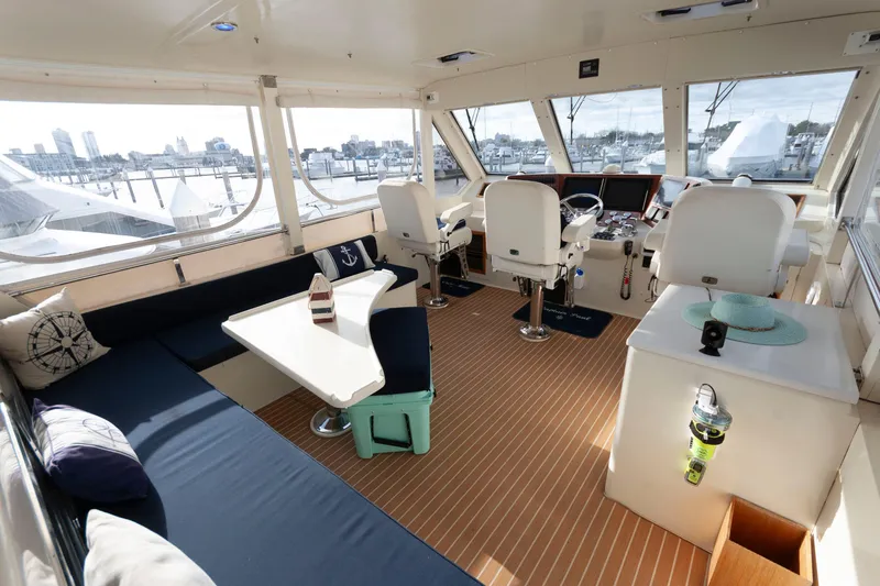 Slide: The Image of Interior of 2007 Novatec 55 Islander CPMY yacht with seating and helm station. - 6