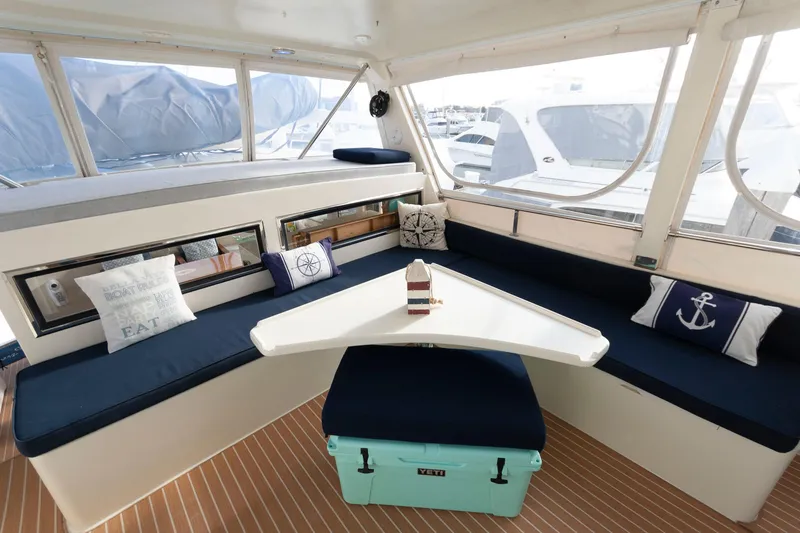 Slide: The Image of Interior of 2007 Novatec 55 Islander CPMY yacht with cozy seating and nautical decor. - 8