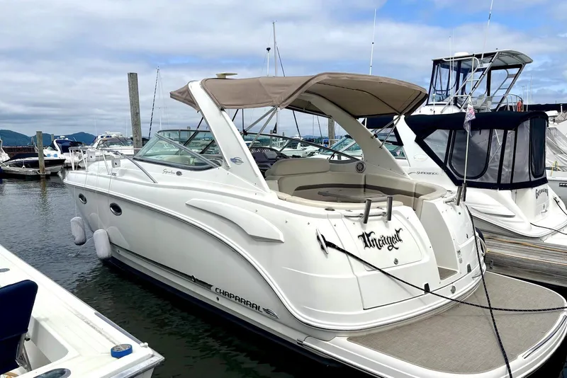 The Image of 2008 Chaparral Signature 330 boat docked at marina, featuring sleek design and spacious deck. - 0