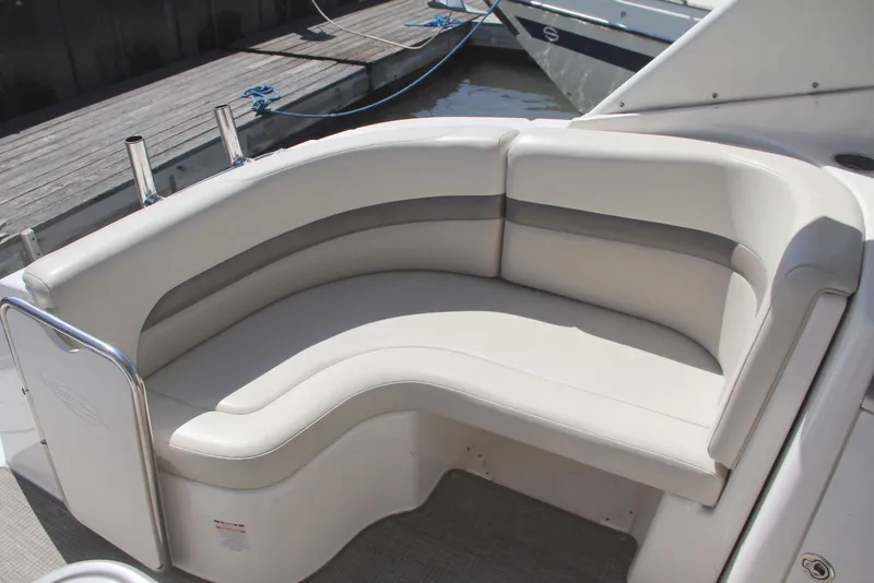 Slide: The Image of 2008 Chaparral Signature 330 boat seating area with white cushioned bench. - 10
