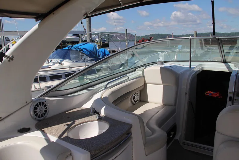 Slide: The Image of 2008 Chaparral Signature 330 boat interior with seating and sink, docked at marina. - 11