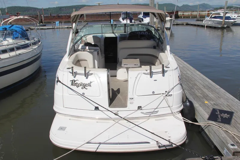 Slide: The Image of 2008 Chaparral Signature 330 boat docked at marina, rear view. - 12