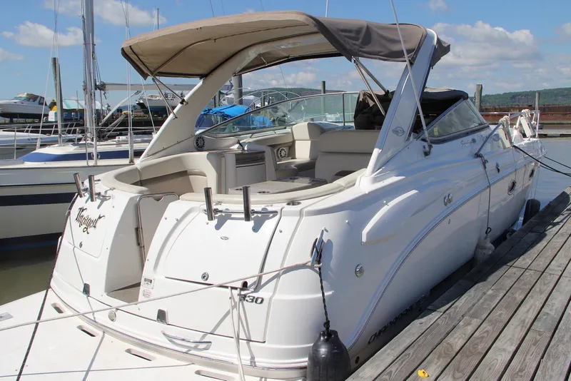 Slide: The Image of 2008 Chaparral Signature 330 boat docked at marina under clear skies. - 2