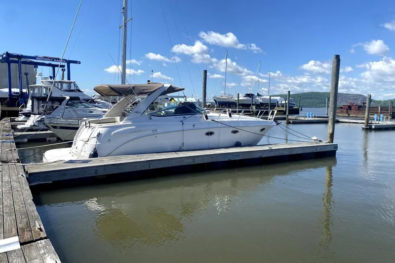 Slide: The Image of 2008 Chaparral Signature 330 boat docked at marina under clear blue sky. - 3