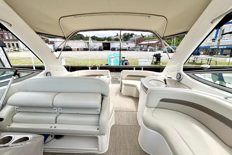 Slide: The Image of 2008 Chaparral Signature 330 boat interior with white seating and outdoor view. - 6