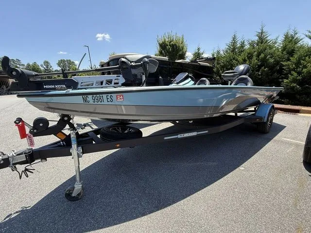 The Image of 2021 Vexus AVX1880 boat on trailer, parked outdoors under clear sky. - 1