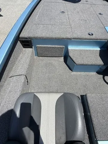 Slide: The Image of 2021 Vexus AVX1880 boat interior with gray seating and carpeted deck. - 6