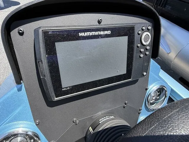 Slide: The Image of Humminbird Helix 7 fish finder on 2021 Vexus AVX1880 boat dashboard. - 7
