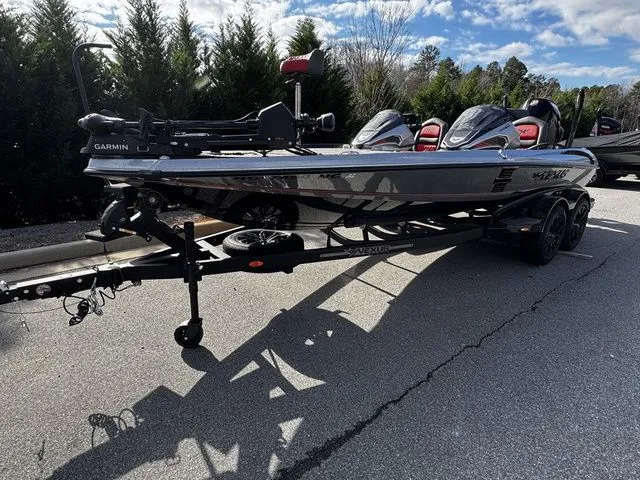 Slide: The Image of 2024 Vexus VXS20 boat on trailer, featuring Garmin equipment, parked on a sunny day. - 3