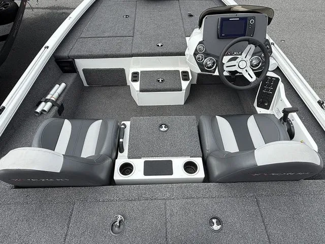 Slide: The Image of 2022 Vexus AVX1880 boat interior with dual seats, steering console, and storage compartments. - 5