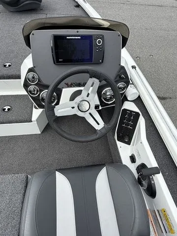 Slide: The Image of 2022 Vexus AVX1880 boat dashboard with steering wheel and navigation display. - 6
