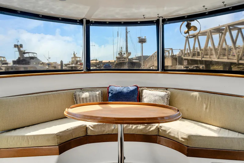 Slide: The Image of Interior view of 1991 TransWorld Fantail 50 Motor Yacht with round seating and table. - 15