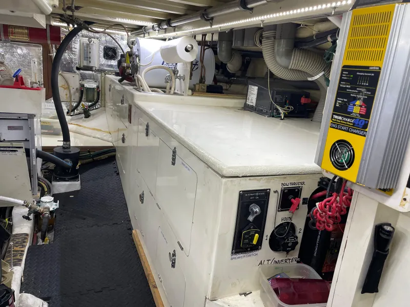 Slide: The Image of Engine room of 1991 TransWorld Fantail 50 Motor Yacht with control panels and equipment. - 25