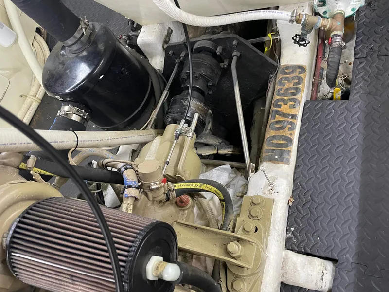 Slide: The Image of Engine compartment of a 1991 TransWorld Fantail 50 Motor Yacht, showcasing mechanical components. - 27