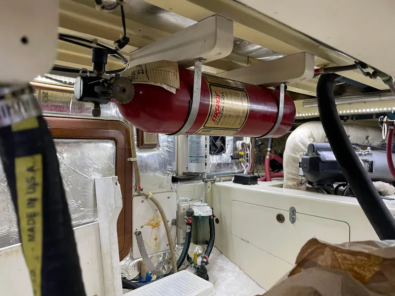 Slide: The Image of Engine room of 1991 TransWorld Fantail 50 Motor Yacht with fire extinguisher and equipment. - 44