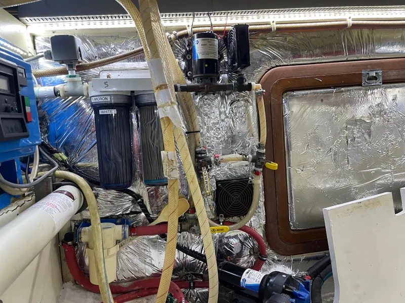 Slide: The Image of Engine room of 1991 TransWorld Fantail 50 Motor Yacht with various mechanical components. - 45