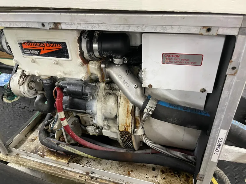 Slide: The Image of Engine compartment of a 1991 TransWorld Fantail 50 Motor Yacht, featuring Northern Lights generator. - 46